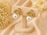 Aretes Nudo Dorado con Perla Acero 316L